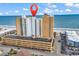Aerial view of the beachfront resort with ocean views and parking garage with a locator pin at 9550 Shore Dr. # 1511, Myrtle Beach, SC 29572