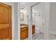 Bathroom showcasing vanity with granite counters, framed mirror, and a toilet at 9550 Shore Dr. # 1511, Myrtle Beach, SC 29572