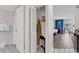 View into bedroom that includes closet, hanging bar, and iron with table at 9550 Shore Dr. # 1511, Myrtle Beach, SC 29572