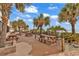 Enjoy outdoor dining surrounded by palm trees and lush landscaping at 9550 Shore Dr. # 1511, Myrtle Beach, SC 29572