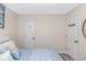 Cozy bedroom with calm, neutral tones and white trim doors for closet and bathroom at 1006 Charles St., North Myrtle Beach, SC 29582