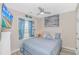 Cozy bedroom with blue accents, a ceiling fan, and decorative window display at 1006 Charles St., North Myrtle Beach, SC 29582