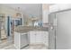 Open kitchen featuring granite countertops, stainless steel appliances, and seamless access to the living area at 1006 Charles St., North Myrtle Beach, SC 29582