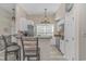Well-appointed kitchen with white cabinets, stainless steel appliances, and breakfast bar seating at 1006 Charles St., North Myrtle Beach, SC 29582