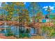 Scenic pond with a fountain, surrounded by trees and colorful landscaping at 1006 Charles St., North Myrtle Beach, SC 29582