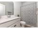 Neat bathroom featuring a vanity with a sink, a toilet, and a shower with a patterned curtain at 10141 Hamilton Branch Loop, Myrtle Beach, SC 29579