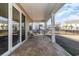 Relaxing covered patio featuring outdoor seating and a tiled floor for enjoying the outdoors at 10141 Hamilton Branch Loop, Myrtle Beach, SC 29579