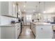 Stylish kitchen boasts stainless steel appliances, a granite-topped island, and ample cabinet space at 10141 Hamilton Branch Loop, Myrtle Beach, SC 29579