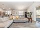 Open-concept living area with modern design, wood floors, and a cozy sectional sofa at 10141 Hamilton Branch Loop, Myrtle Beach, SC 29579