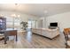 Spacious and bright living room featuring stylish decor and access to the outdoor space at 10141 Hamilton Branch Loop, Myrtle Beach, SC 29579
