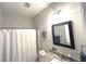 Bathroom with a shower/tub, granite countertop sink, and modern fixtures at 1024 Ray Costin Way # Villa 711, Murrells Inlet, SC 29576