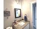Cozy bathroom featuring granite countertops, modern fixtures, and beach decor at 1024 Ray Costin Way # Villa 711, Murrells Inlet, SC 29576