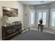 Bedroom with light gray walls, natural light, dark dresser, and a metal bed frame at 1024 Ray Costin Way # Villa 711, Murrells Inlet, SC 29576