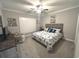 Bright bedroom with seahorse bedding, plantation shutters, ceiling fan, and neutral decor at 1024 Ray Costin Way # Villa 711, Murrells Inlet, SC 29576