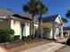 Clubhouse exterior with well-manicured landscaping and palm trees at 1024 Ray Costin Way # Villa 711, Murrells Inlet, SC 29576