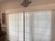This living room has large sliding glass doors with decorative blinds and decor at 1024 Ray Costin Way # Villa 711, Murrells Inlet, SC 29576