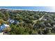 Stunning aerial view of homes nestled among lush trees near the sparkling ocean at 108 Cole Dr., Pawleys Island, SC 29585