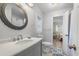 Well-lit bathroom with modern fixtures, decorative tile flooring, and stylish mirror at 108 Cole Dr., Pawleys Island, SC 29585