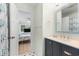 Bathroom featuring a stylish vanity and a glimpse into a cozy bedroom at 108 Cole Dr., Pawleys Island, SC 29585