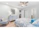 Airy bedroom with a decorative mirror and a comfortable upholstered chair at 108 Cole Dr., Pawleys Island, SC 29585