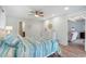 Bright bedroom with a beach theme, ceiling fan and a view to a living area at 108 Cole Dr., Pawleys Island, SC 29585