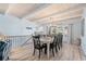 Bright dining room featuring wood floors, a rustic table and chair set, plus wood-beam ceilings at 108 Cole Dr., Pawleys Island, SC 29585