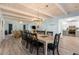Spacious dining area with an elegant chandelier, open to the living room and kitchen at 108 Cole Dr., Pawleys Island, SC 29585