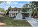 Inviting two-story home with a spacious driveway, elevated porch, and a convenient garage at 108 Cole Dr., Pawleys Island, SC 29585