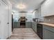 Well-lit kitchen featuring stainless steel appliances, light countertops, and two-tone cabinetry at 108 Cole Dr., Pawleys Island, SC 29585