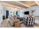 Spacious living room featuring wood-beamed ceilings, comfortable seating, and natural light at 108 Cole Dr., Pawleys Island, SC 29585