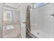 Bright bathroom featuring a walk-in shower with a curtain, showcasing a clean design and ample natural light at 108 Silver Peak Dr., Conway, SC 29526