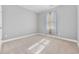 Bright bedroom featuring neutral carpet, gray walls and natural light through window at 108 Silver Peak Dr., Conway, SC 29526