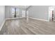 Bright living room with wood floors, neutral paint, and access to the kitchen at 108 Silver Peak Dr., Conway, SC 29526