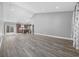 An open floor plan with hardwood floors offers kitchen view and natural light at 108 Silver Peak Dr., Conway, SC 29526
