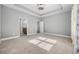 Main bedroom showing neutral paint, plush carpet, and access to the en-suite bathroom at 108 Silver Peak Dr., Conway, SC 29526