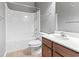 Bathroom highlighting tub-shower combo, matching vanity, and neutral tile flooring at 1097 Balmore Dr., Myrtle Beach, SC 29579