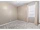 Neutral bedroom showcasing plush carpeting, soft window light, and minimalist design at 1097 Balmore Dr., Myrtle Beach, SC 29579