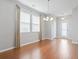 Elegant dining room featuring hardwood floors, ample natural light, and a decorative lighting fixture at 1097 Balmore Dr., Myrtle Beach, SC 29579