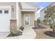 Inviting home entrance featuring a well-lit walkway, mature landscaping, and a covered entryway at 1097 Balmore Dr., Myrtle Beach, SC 29579