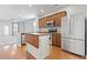 Open kitchen with stainless steel appliances, an island, hardwood floors and ample counter space at 1097 Balmore Dr., Myrtle Beach, SC 29579