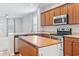 Well-lit kitchen featuring stainless steel appliances, granite countertops, and an island with seating at 1097 Balmore Dr., Myrtle Beach, SC 29579