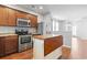 Bright kitchen featuring stainless steel appliances, granite countertops, and hardwood flooring at 1097 Balmore Dr., Myrtle Beach, SC 29579
