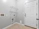 Functional laundry area with shelving and connections for a washer and dryer at 1097 Balmore Dr., Myrtle Beach, SC 29579