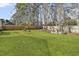 The large backyard features a well-manicured lawn and is bordered by a wooden fence at 11 Ryan Ln., Myrtle Beach, SC 29579