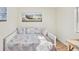 Bright bedroom featuring a daybed with decorative pillows, and a seaside art piece at 11 Ryan Ln., Myrtle Beach, SC 29579