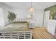 Inviting bedroom featuring bed, nightstand, and modern light fixture at 11 Ryan Ln., Myrtle Beach, SC 29579