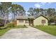 Charming one-story home featuring a well-manicured front yard, and a paved driveway at 11 Ryan Ln., Myrtle Beach, SC 29579