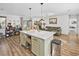 Beautiful living area with open floor plan and a kitchen island, hardwood floors, and stylish furnishings at 11 Ryan Ln., Myrtle Beach, SC 29579