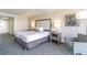 Bright, clean bedroom with a cozy bed, lamps on bedside tables, and a comfortable armchair at 1105 S Ocean Blvd. # 446, Myrtle Beach, SC 29577