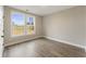 Neutral bedroom featuring a large window and modern flooring at 1110 N Middleton Dr. Nw, Calabash, NC 28467